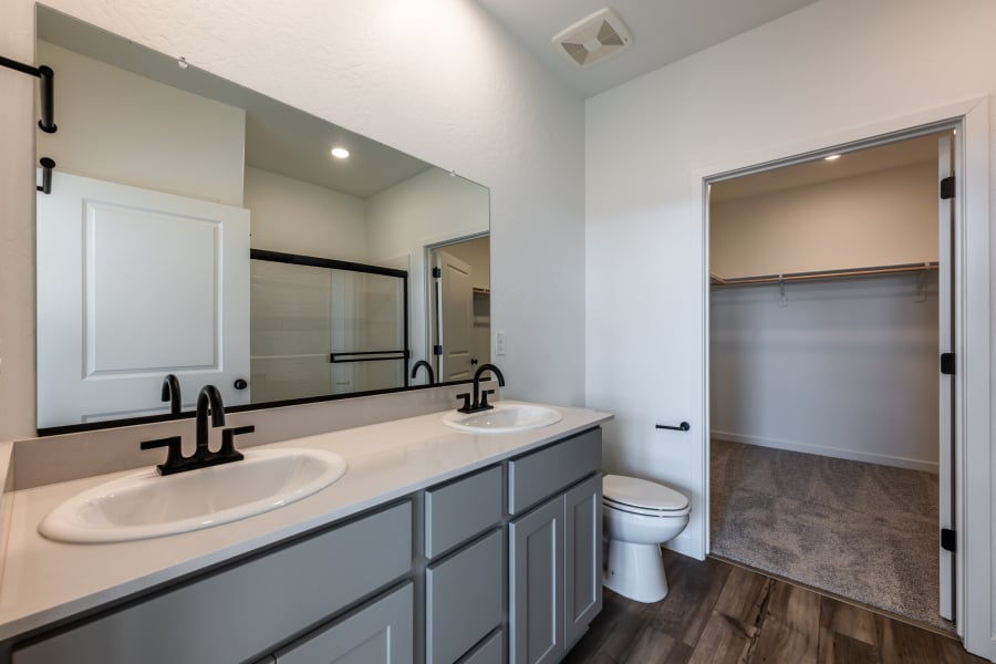 A bathroom with a sink and a toilet.