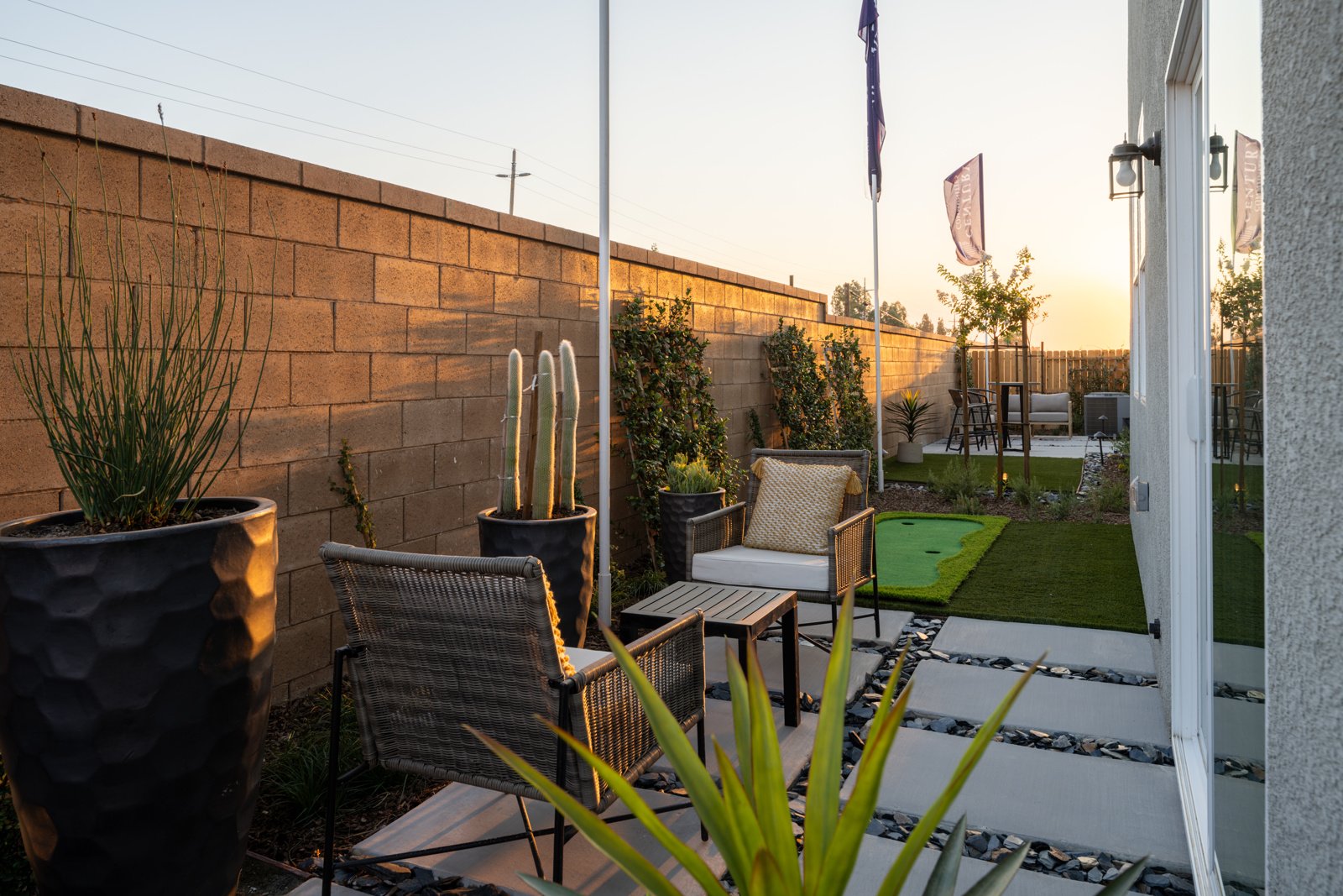 A patio with a table and chairs.