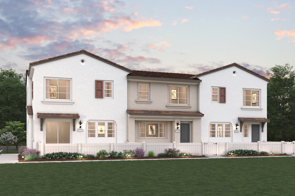 A large house with a lawn in front of it.
