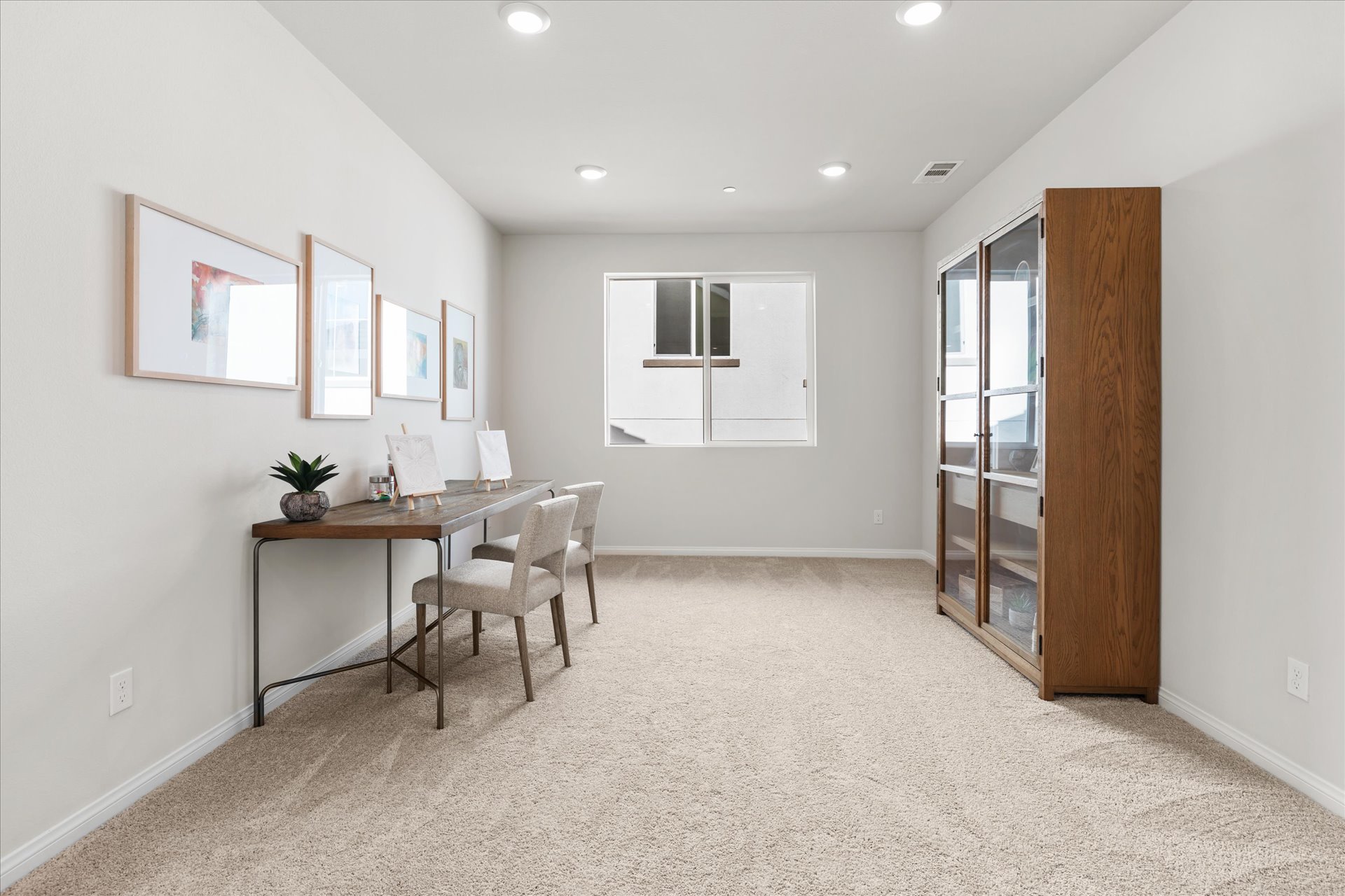 A room with a desk and a chair.