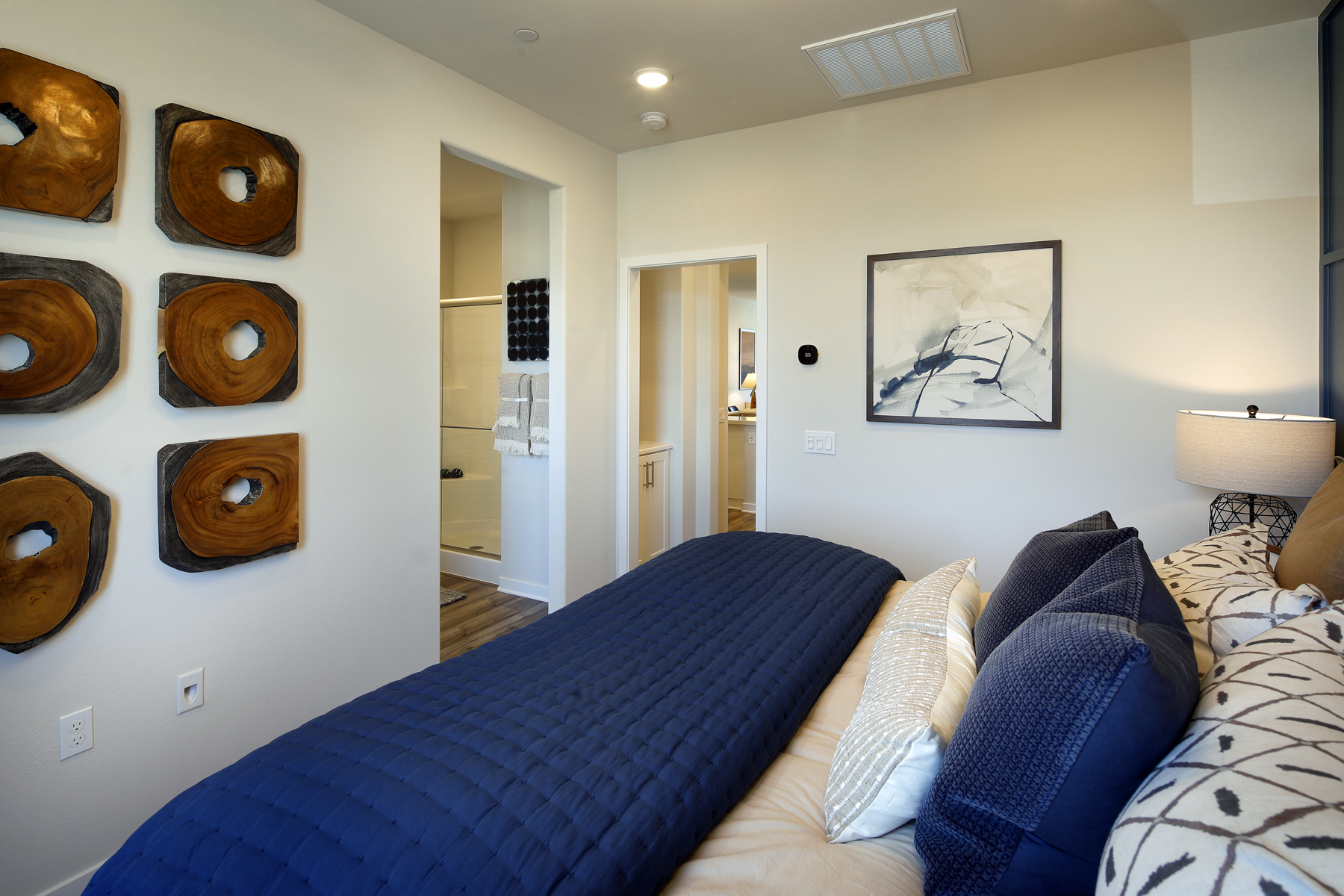 A bedroom with a bed and a couch.