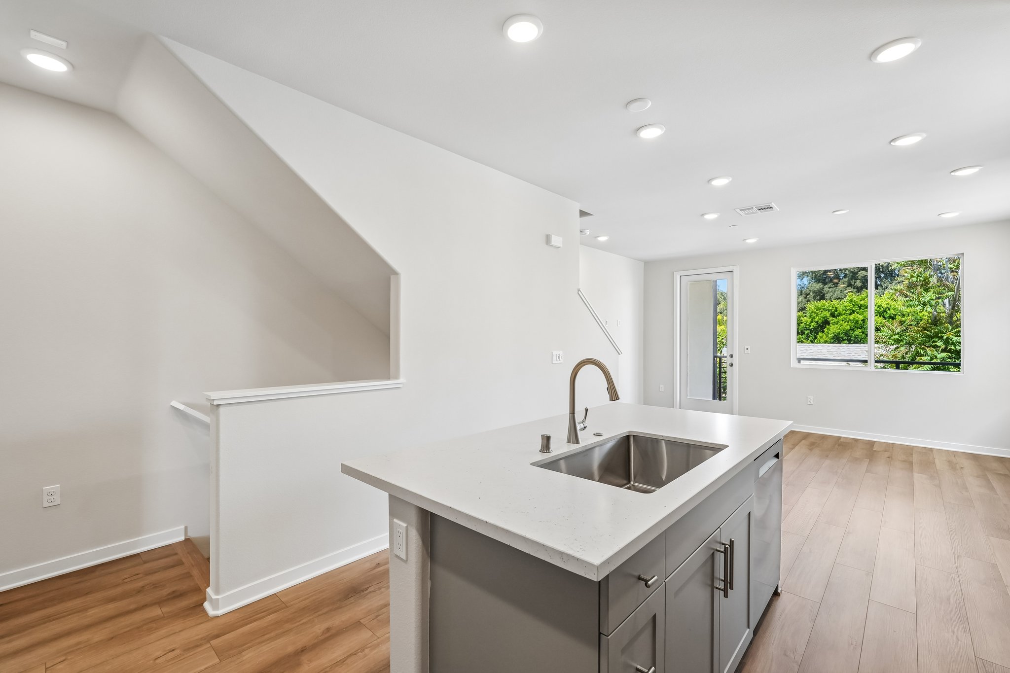A kitchen with a sink and a window.