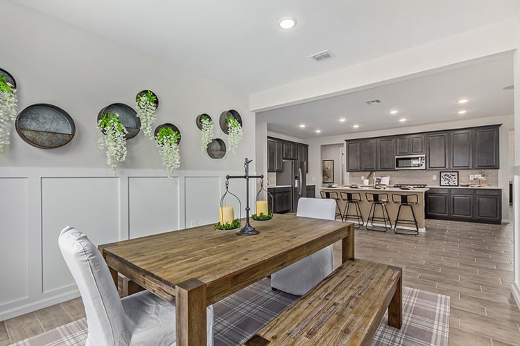A kitchen with a dining table.