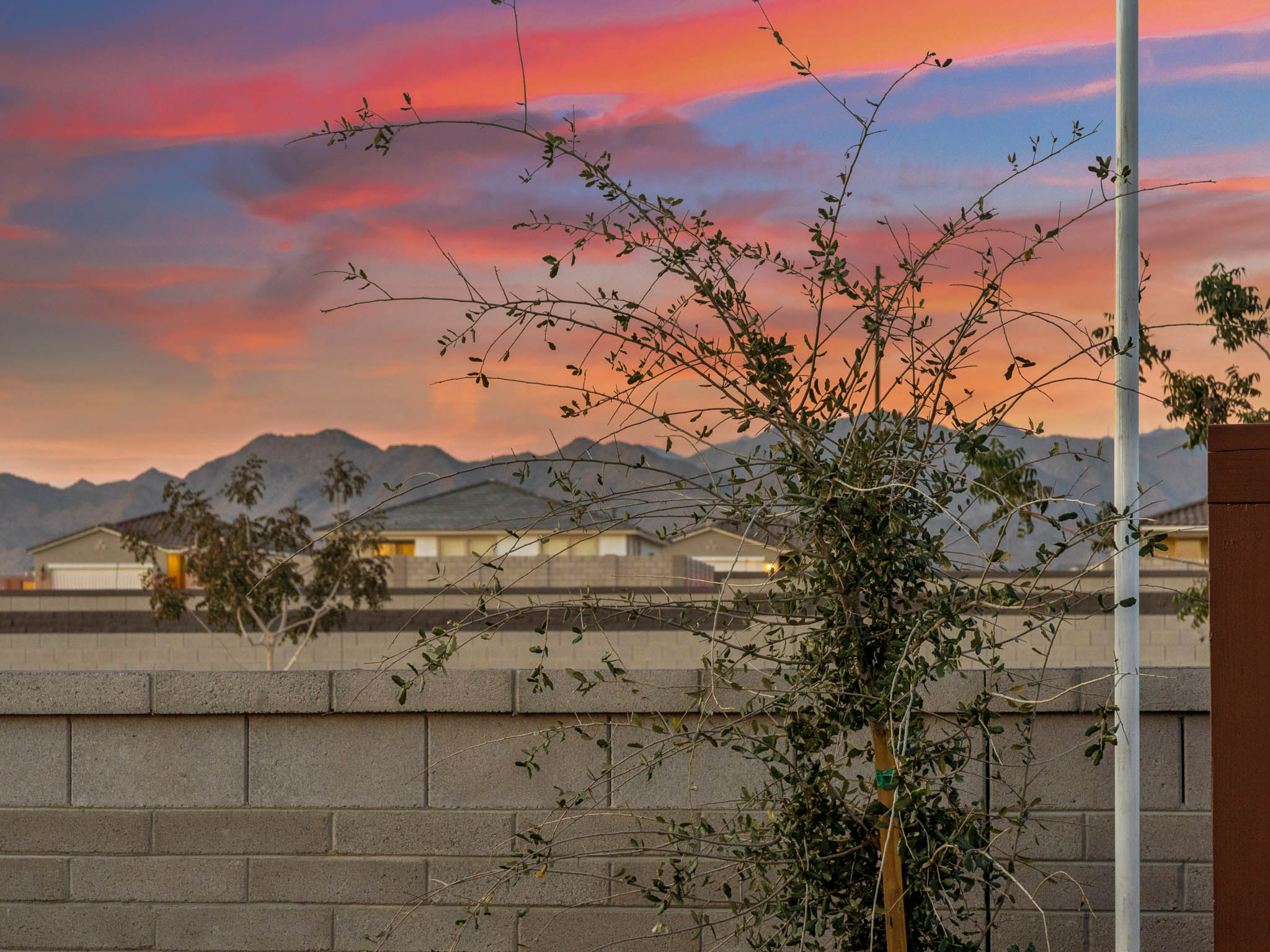 A building with a sunset in the background.
