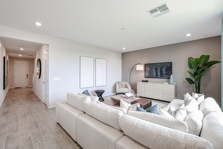 A living room with a white couch.