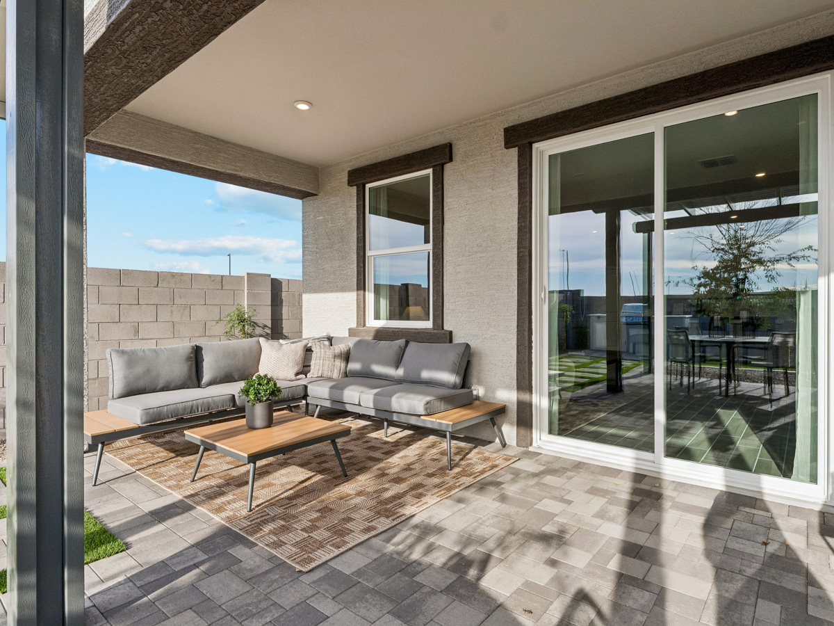 A living room with a large glass door.
