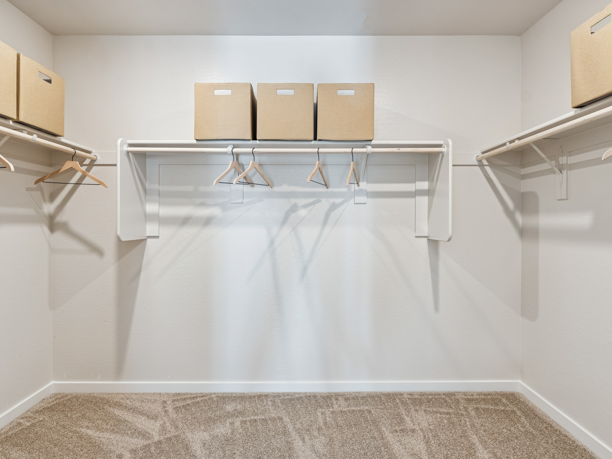 A room with a glass wall and a white floor with a white wall.