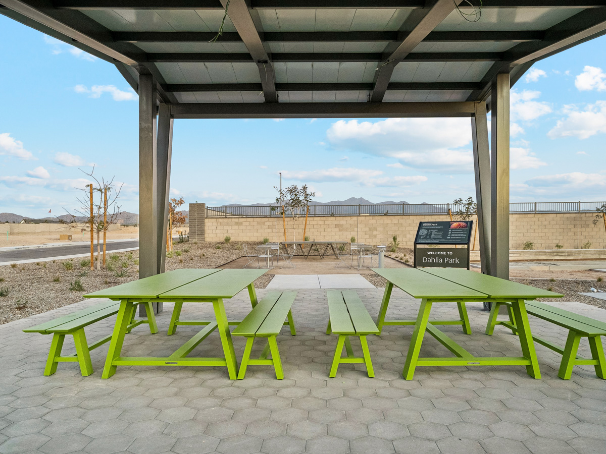A group of tables and chairs outside.