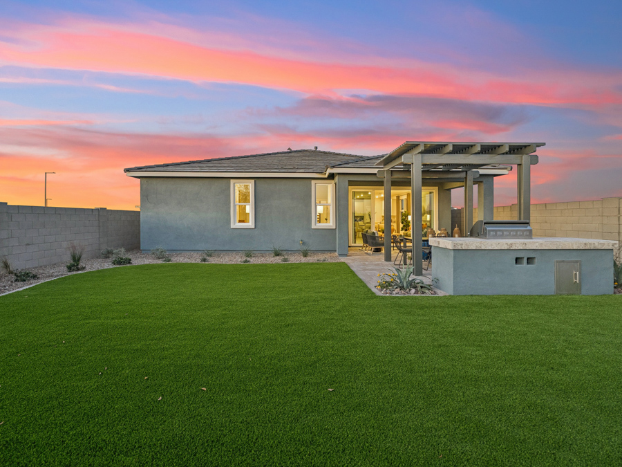 A house with a grass yard.