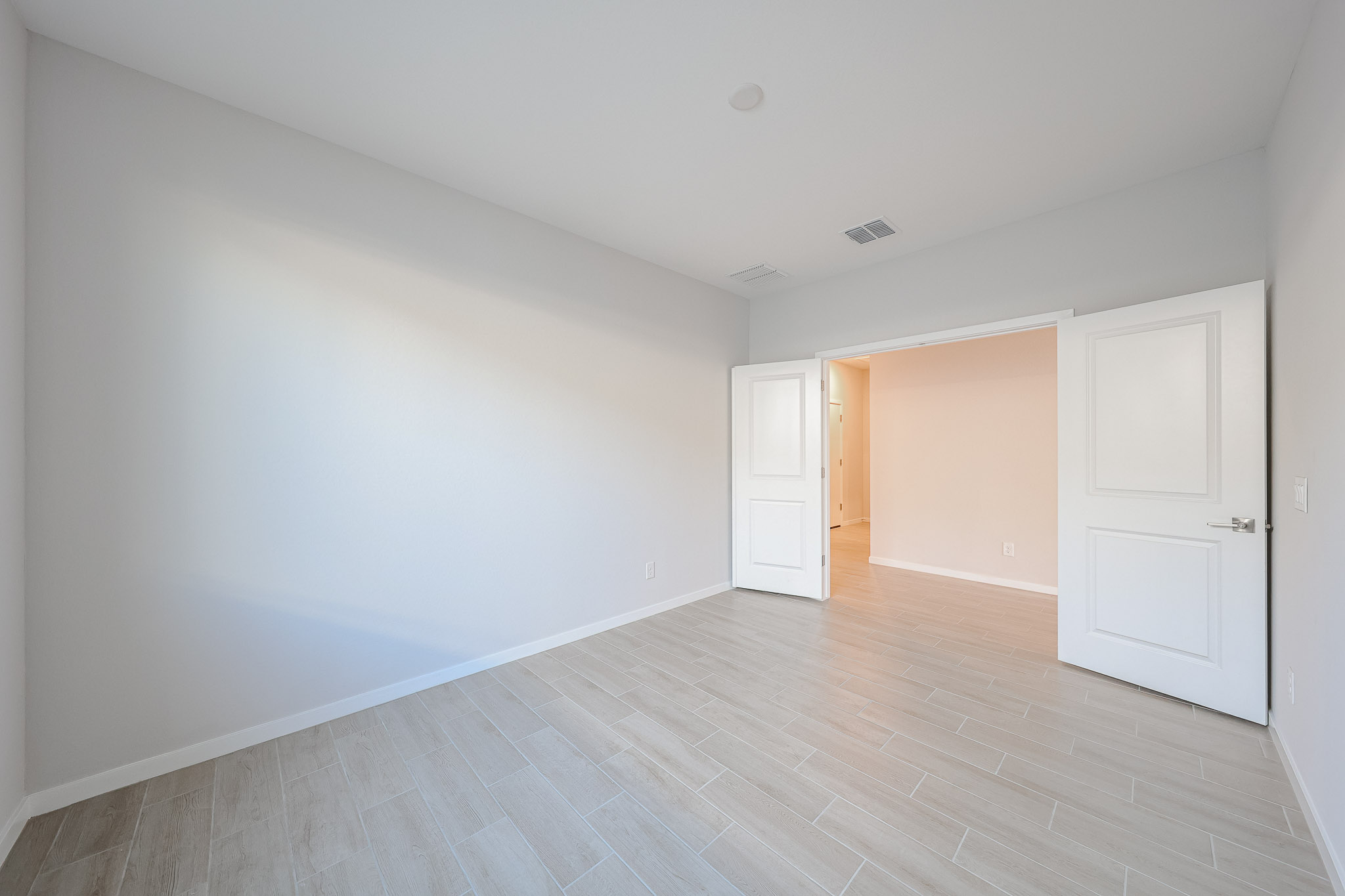 A room with white doors.