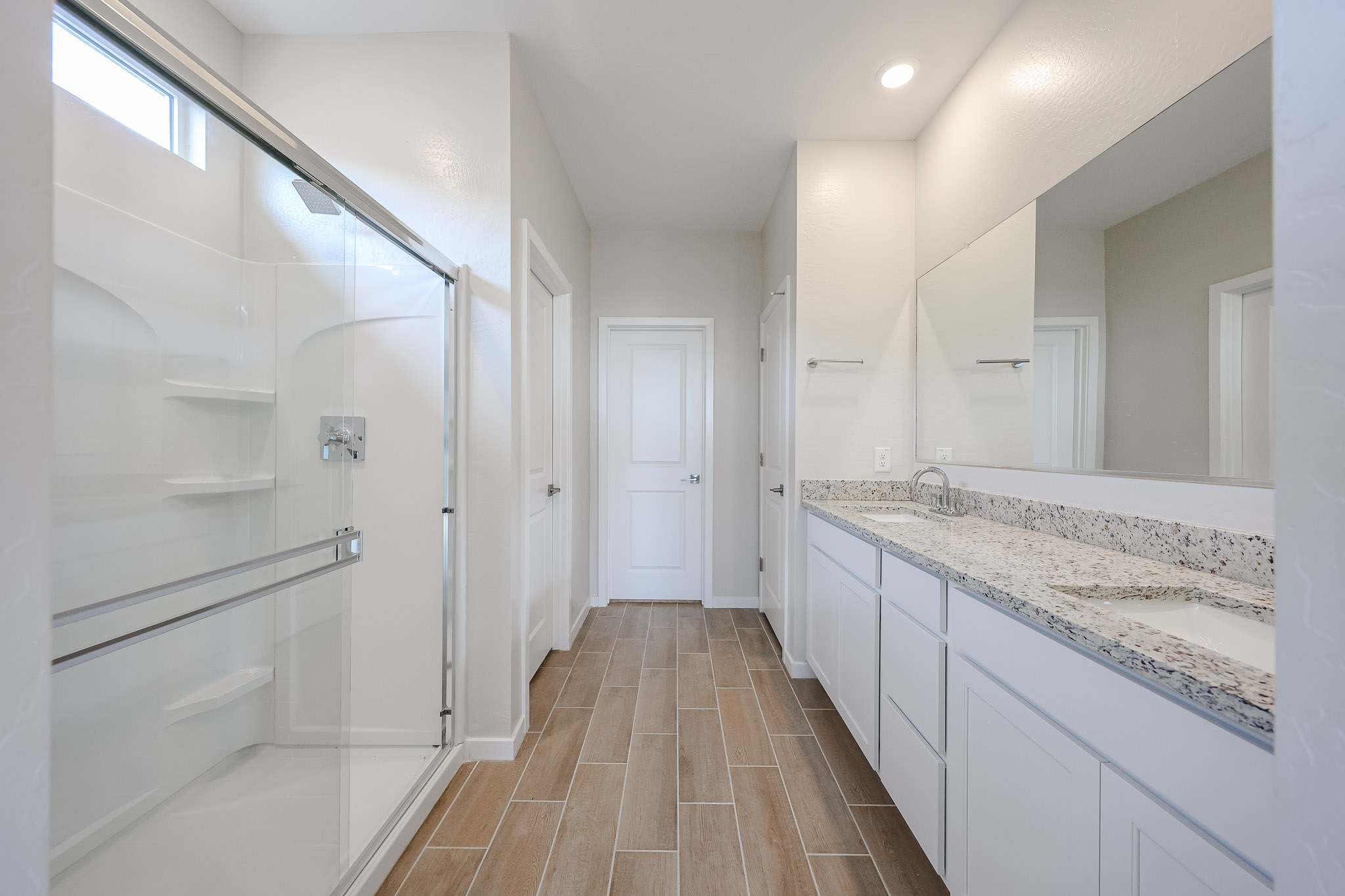 A bathroom with a glass shower.