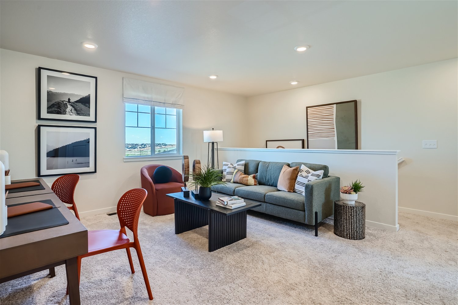 A living room with a couch and a table.