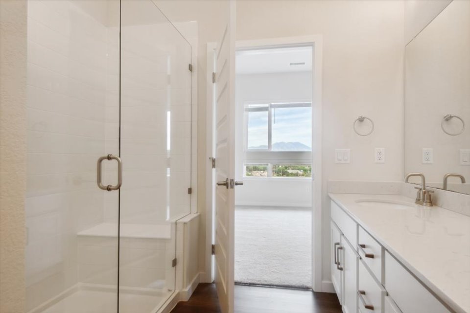 A bathroom with a glass shower.