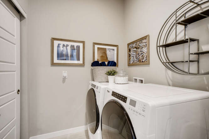 A white washer and dryer in a room.