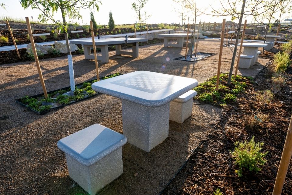 A group of white rectangular objects in a yard.
