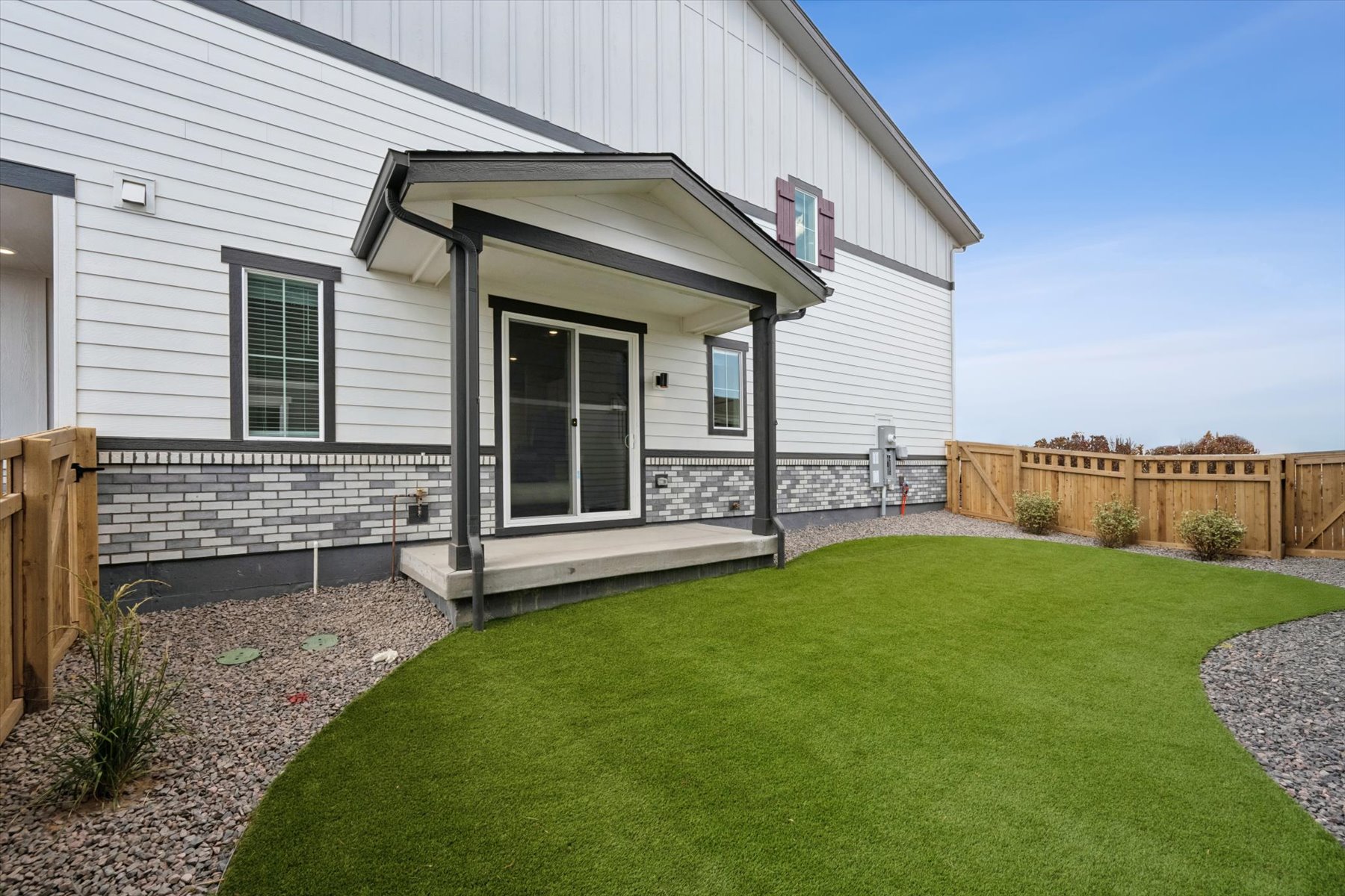 A house with a green lawn.