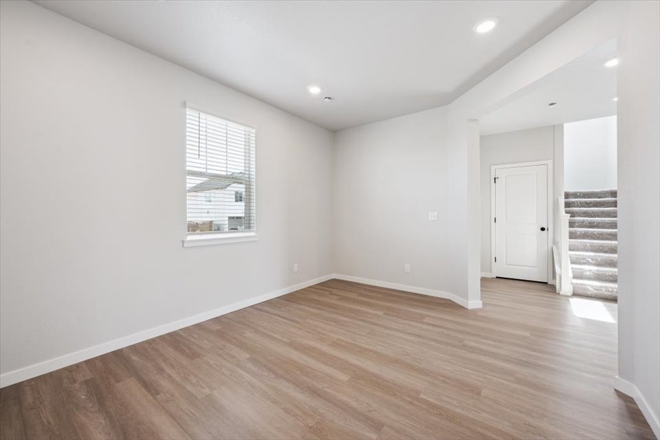 A room with a wood floor and a wood floor.