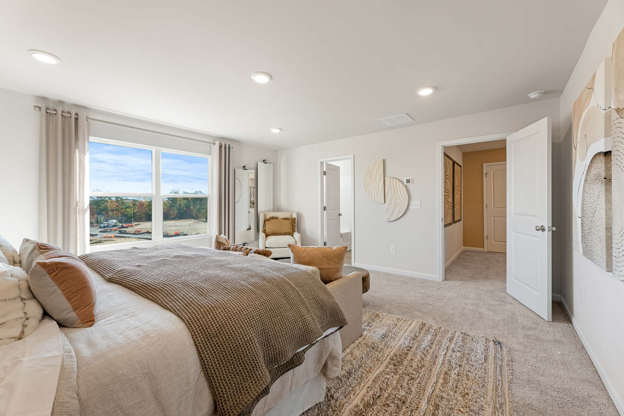 A bedroom with a large bed.