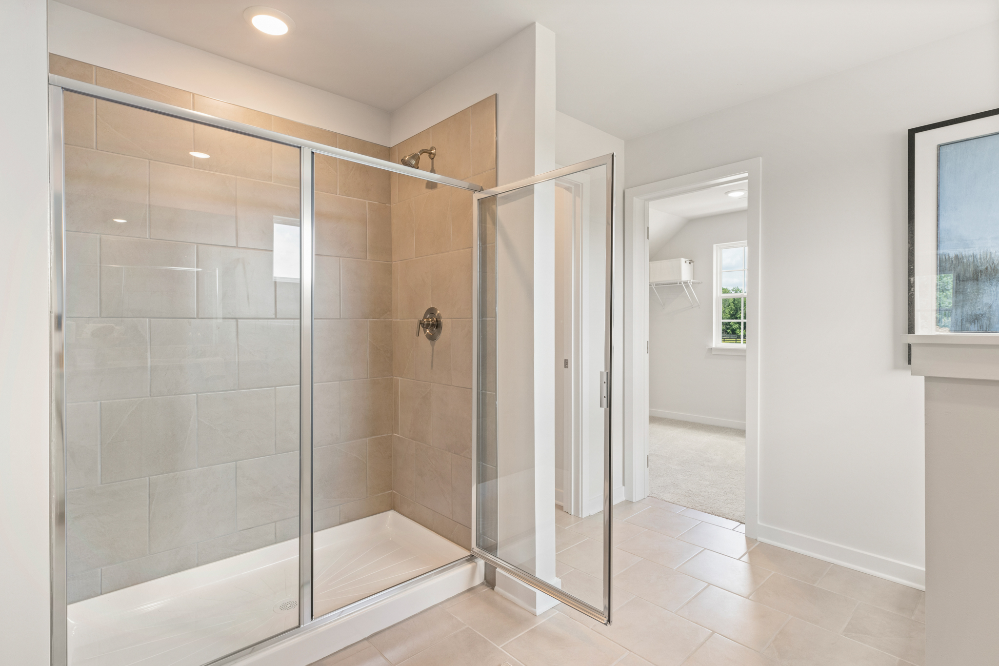 A bathroom with a glass shower.