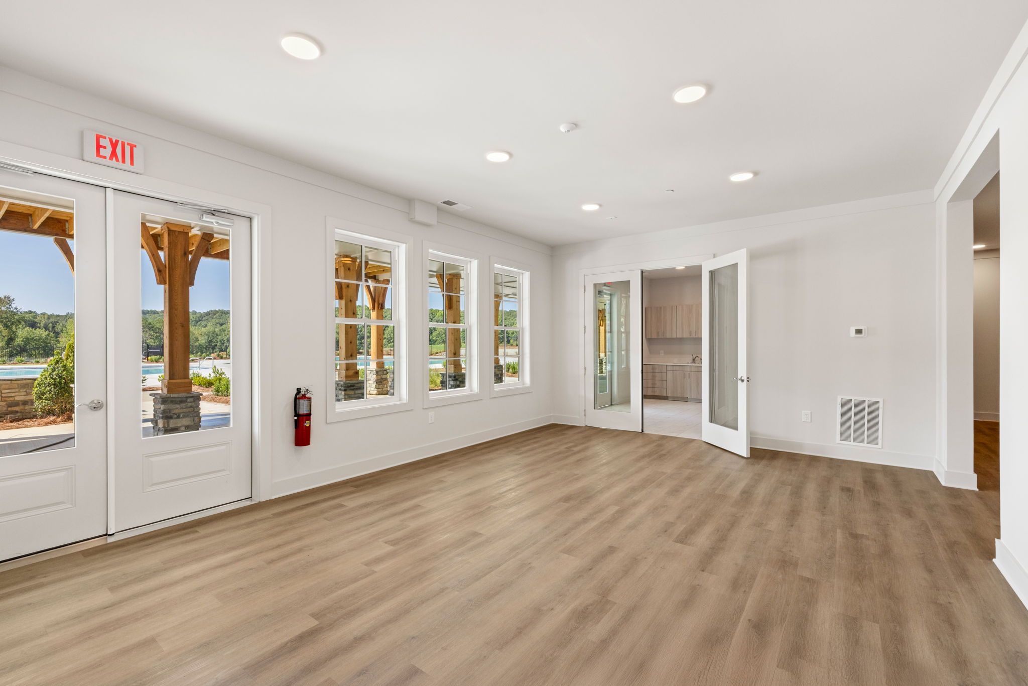 A room with white walls and a wood floor.