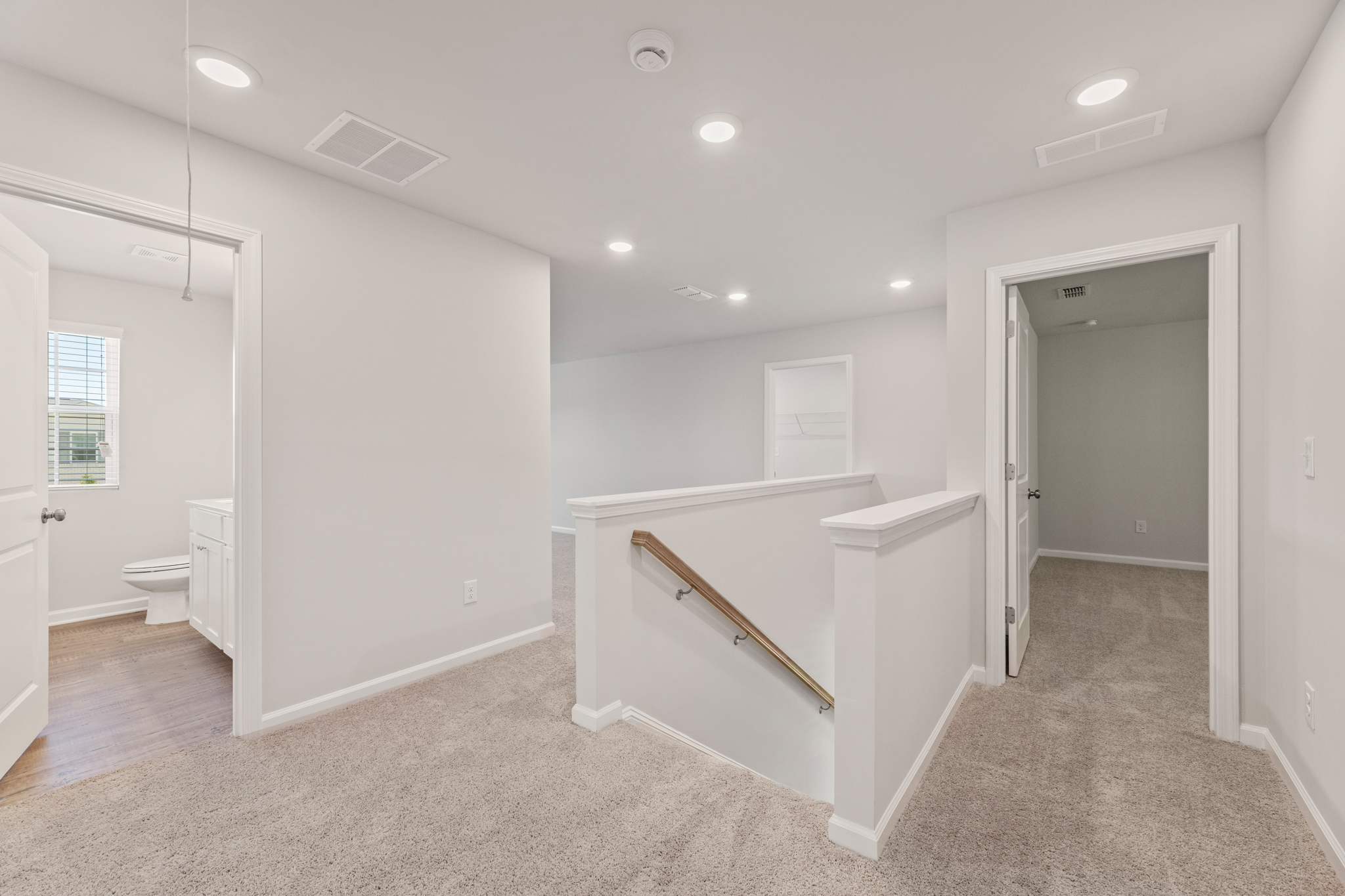 A bathroom with a tub and toilet.