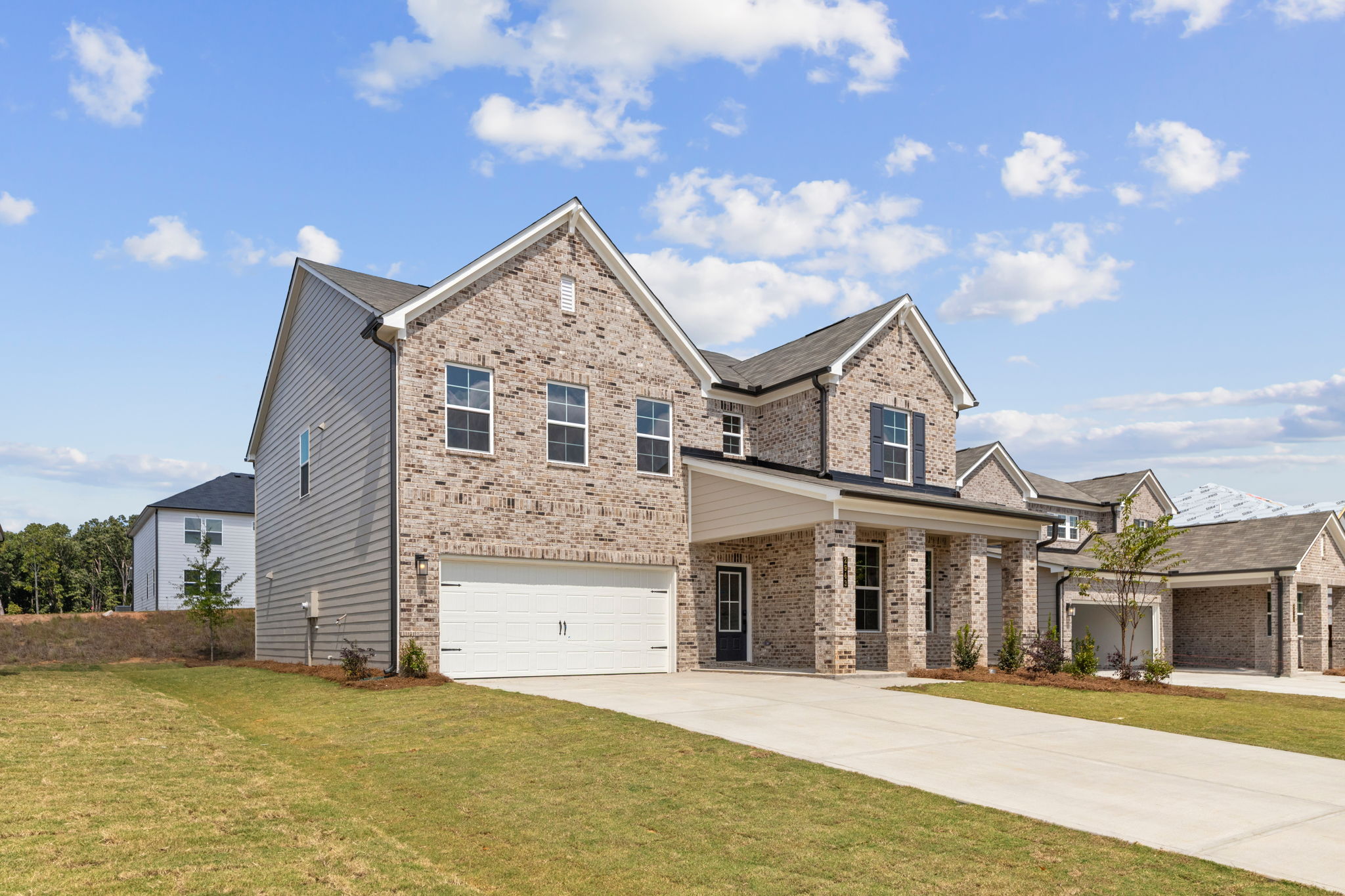 A large house with a driveway.