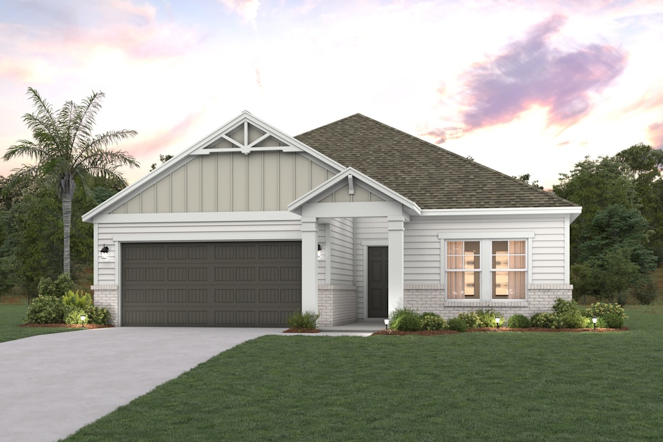 A house with a garage and trees.