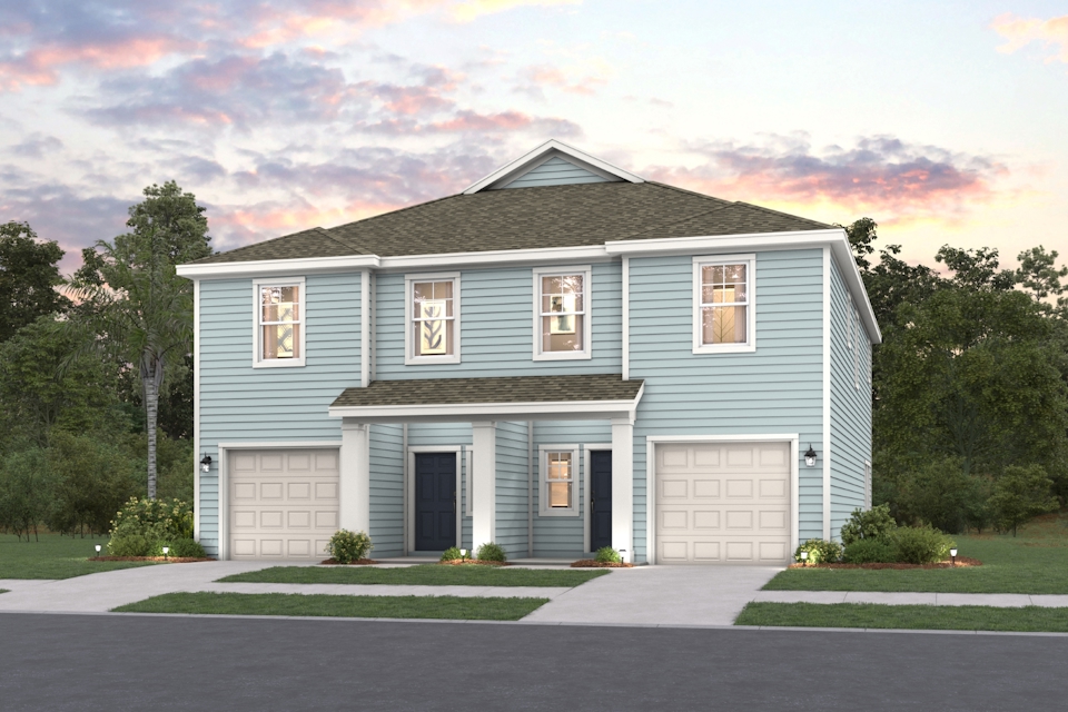 A blue house with garages.