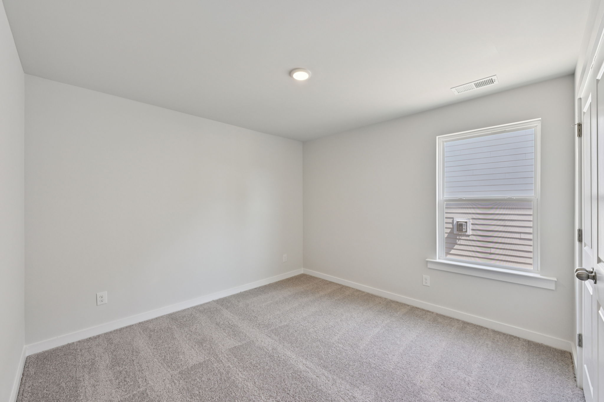 A room with a door and a window.