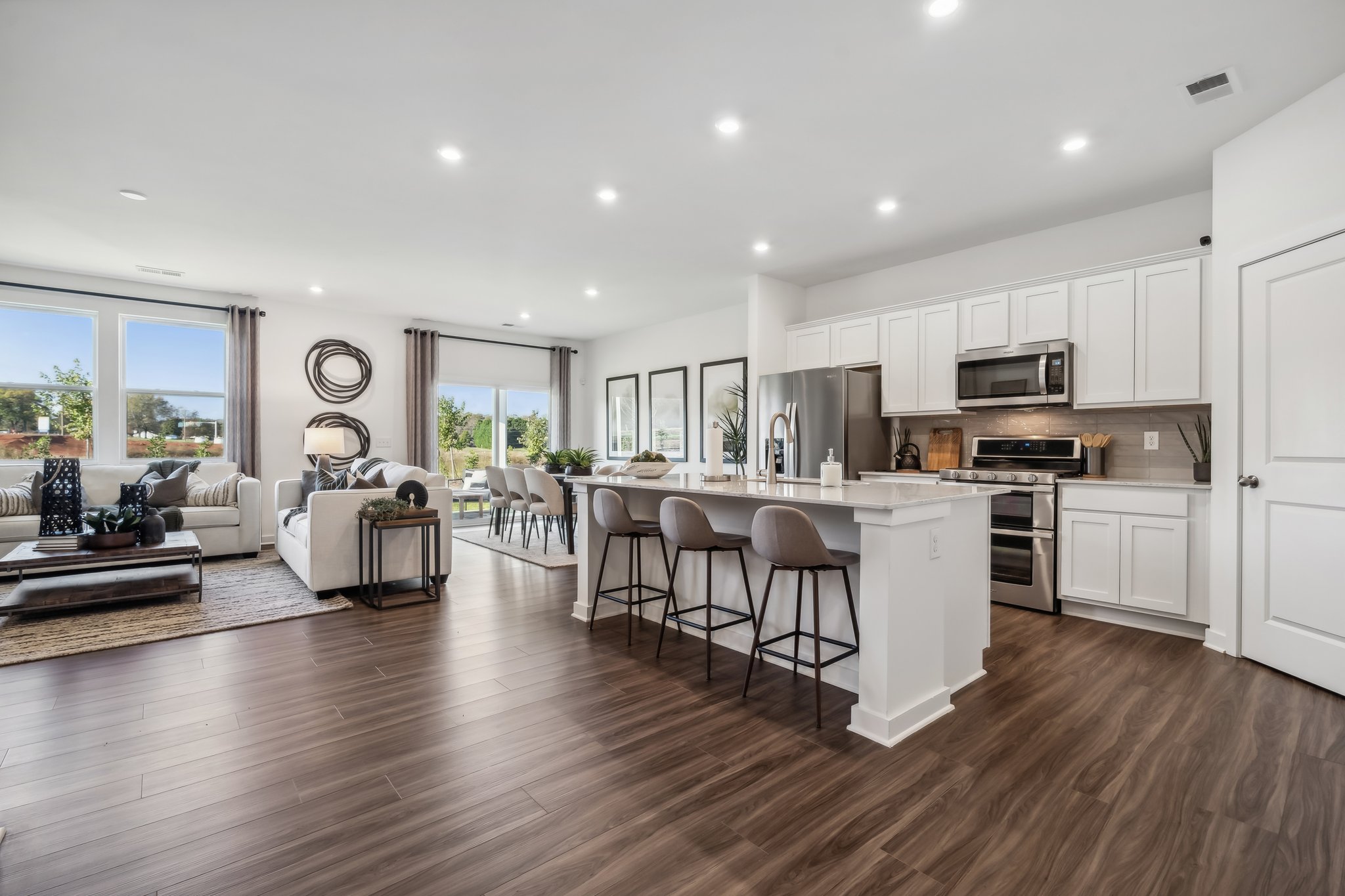 A large kitchen with white cabinets.