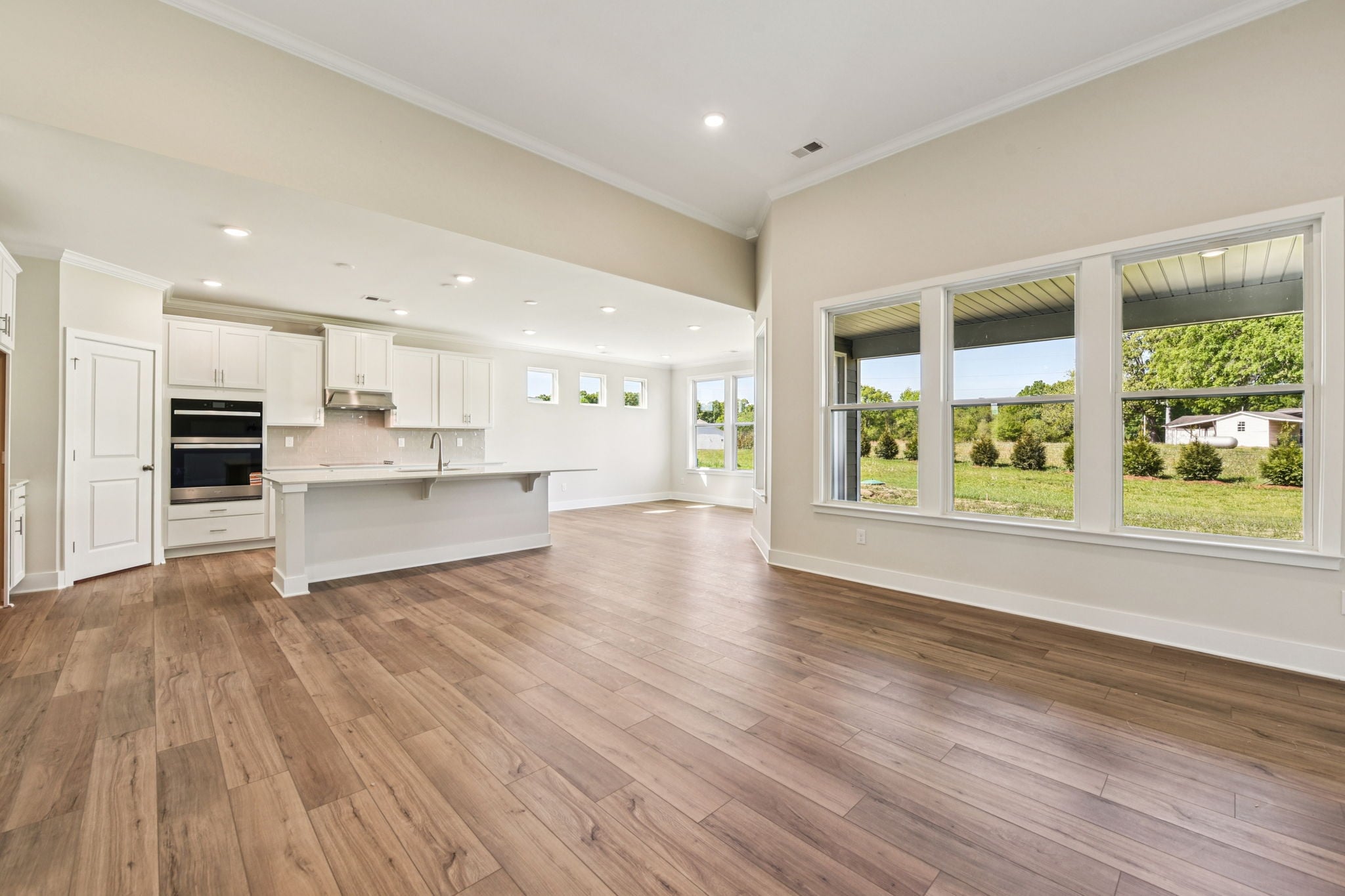 A large kitchen with white cabinets.