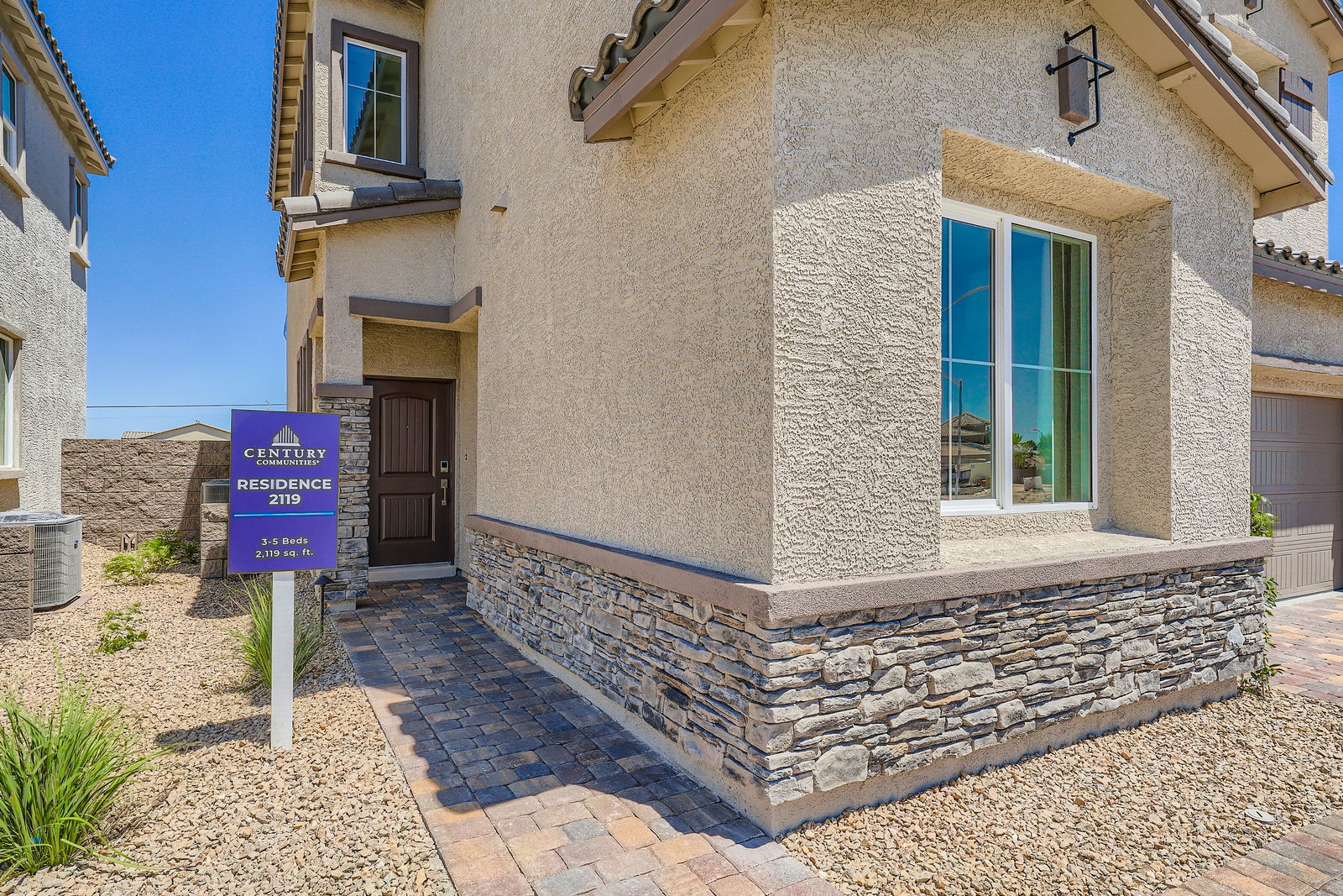 A building with a sign in front.