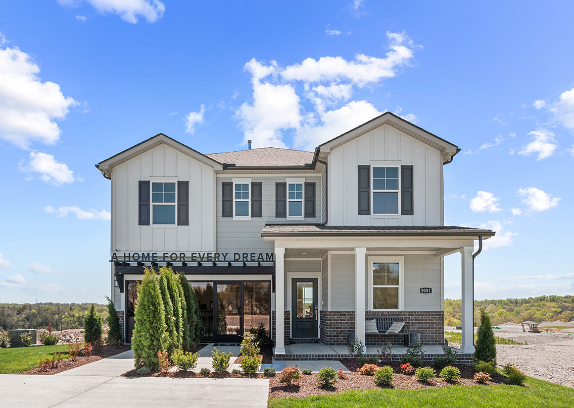 A white house with a blue sky.