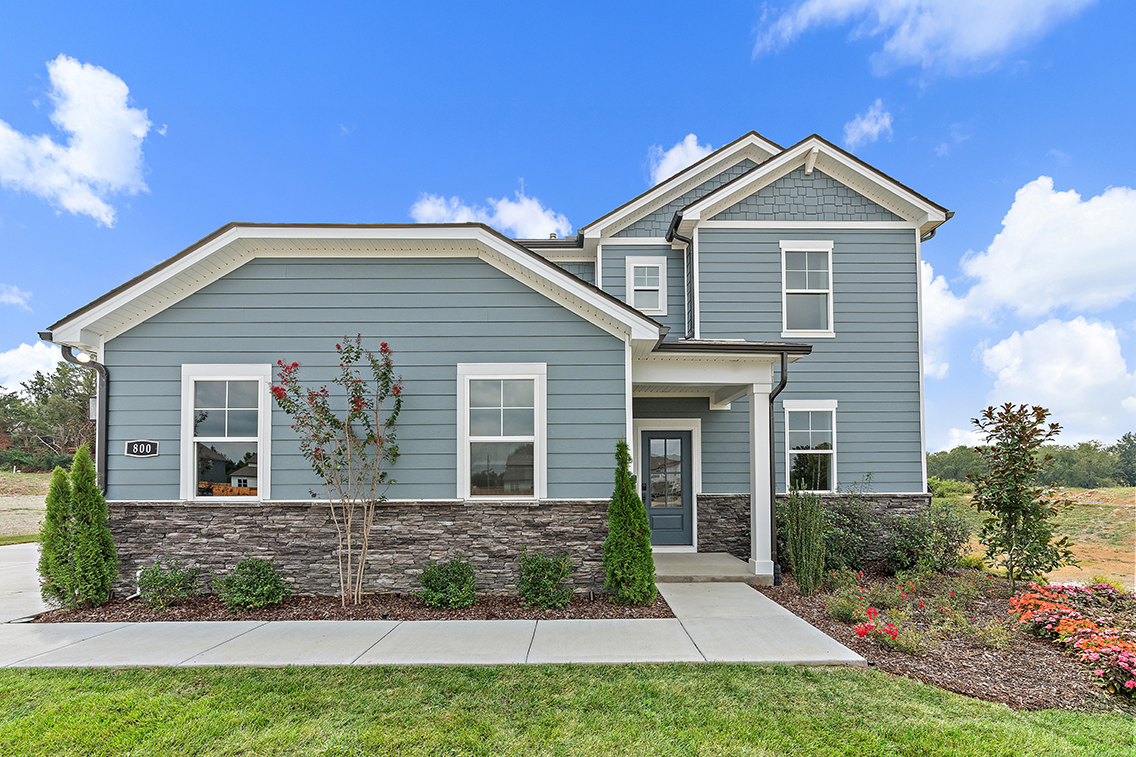 A house with a large front yard.