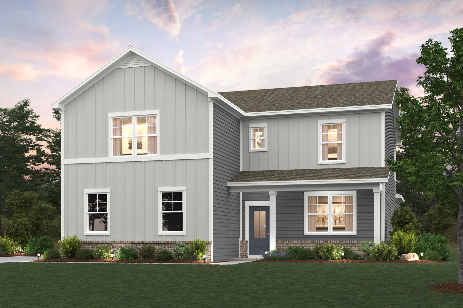 A house with a lawn in front of it.