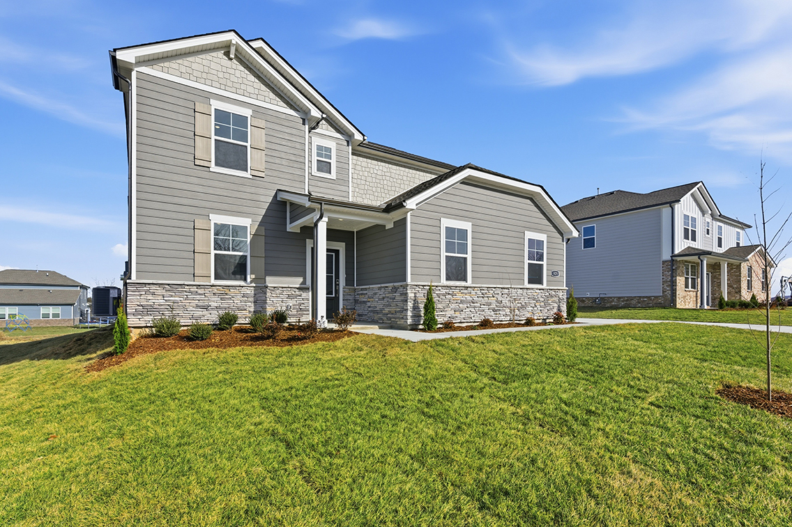 A house with a grass yard.