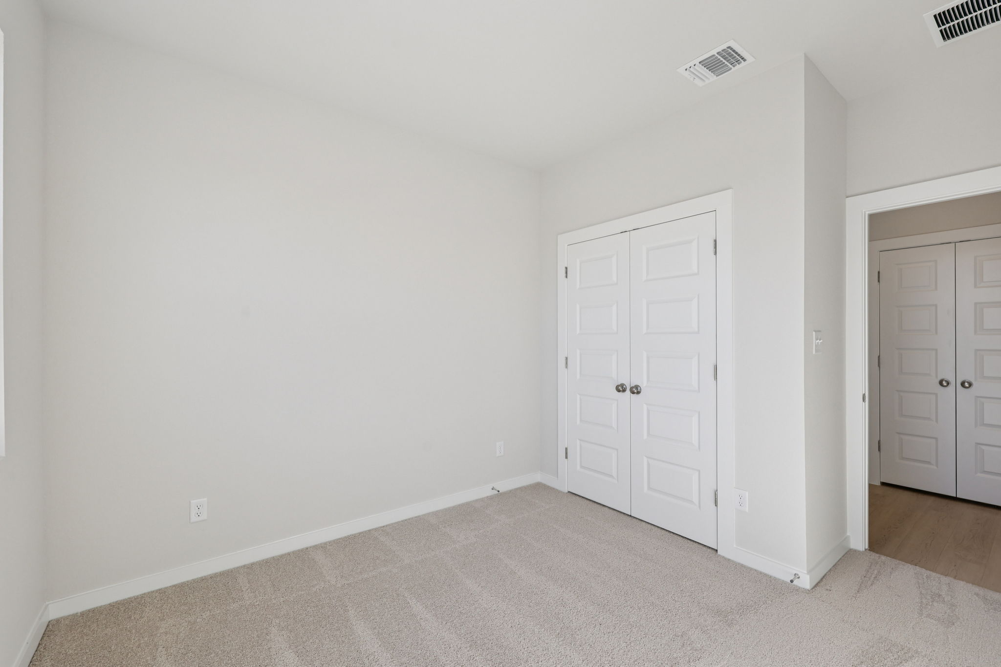 A room with white doors.