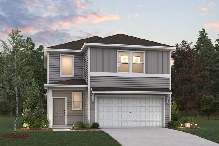 A house with a garage and trees.