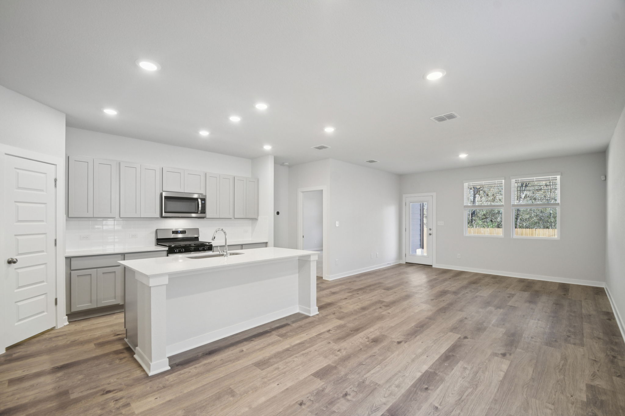 A large kitchen with white cabinets.