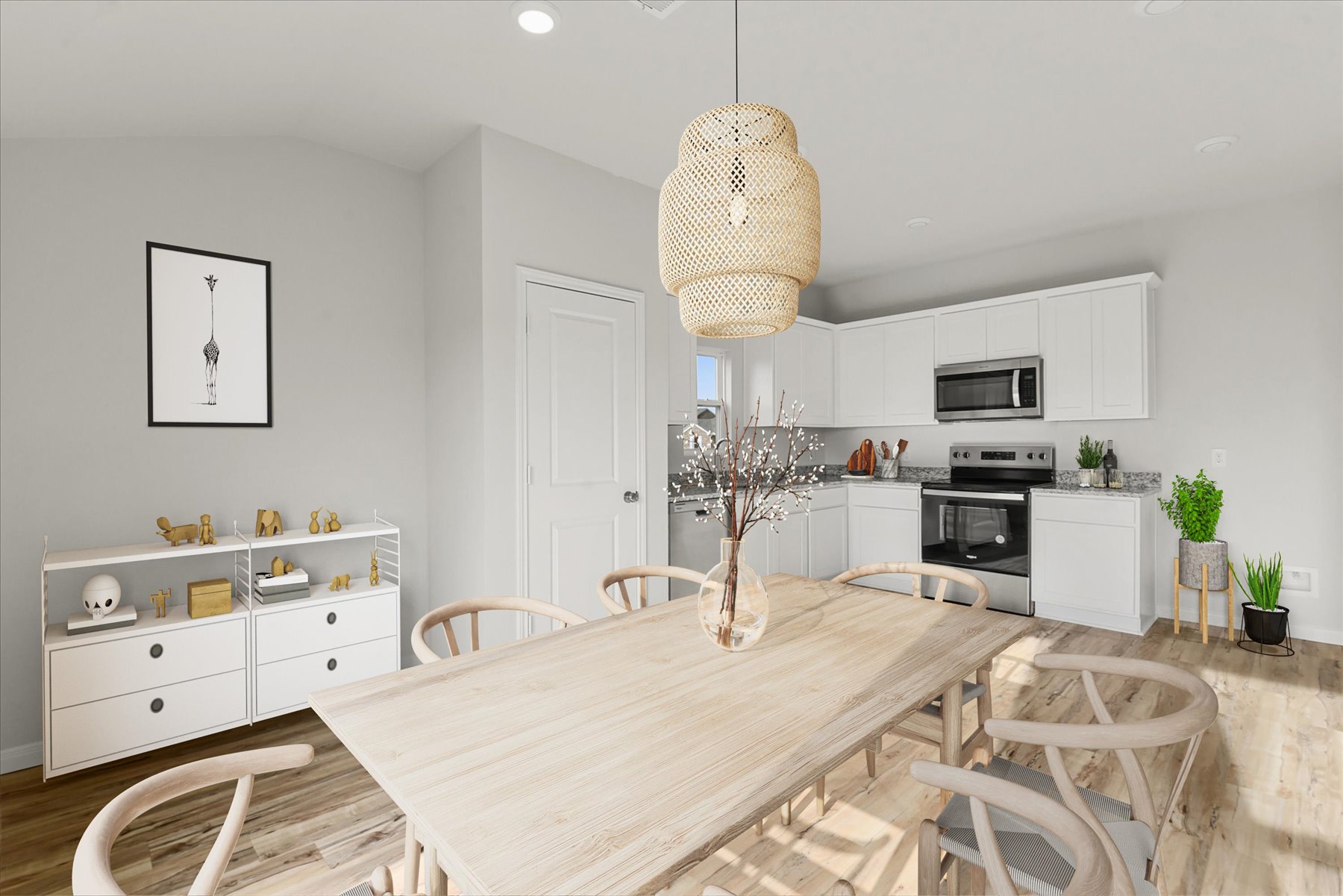 A kitchen with a dining table.
