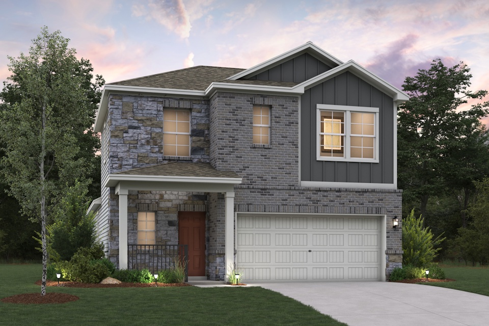 A house with a garage and trees.