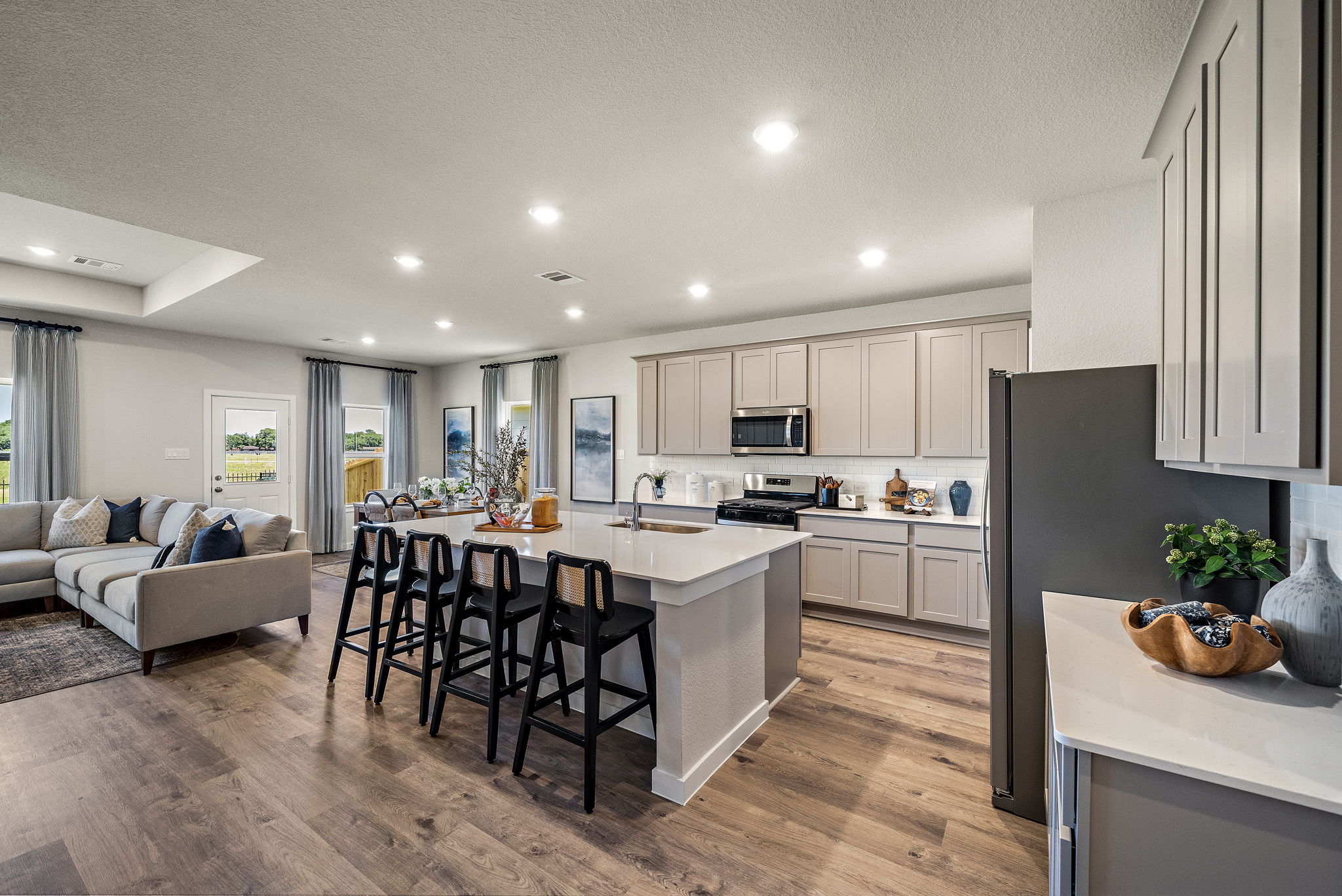 A kitchen with a wood floor.