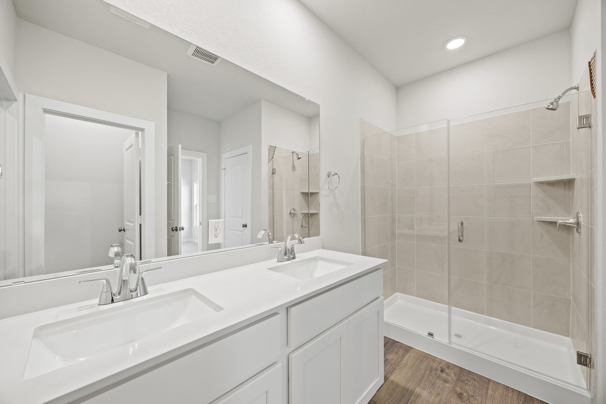 A bathroom with a glass shower.