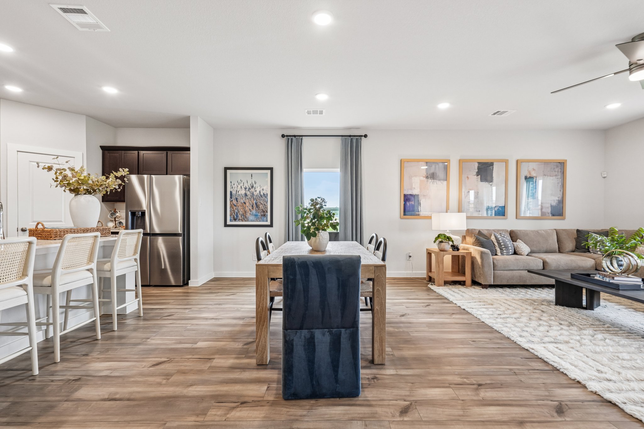 A large living room with a wood floor and a wood floor.