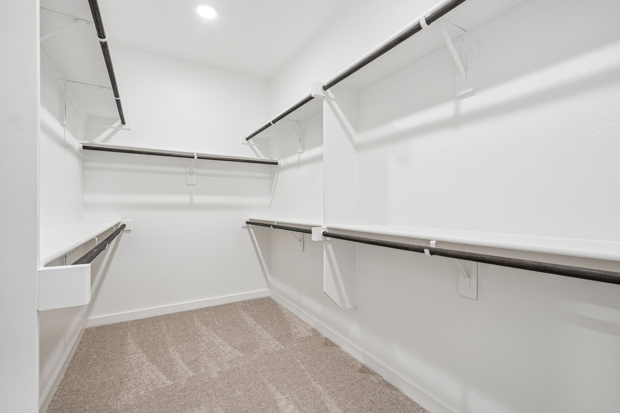A white room with a staircase.