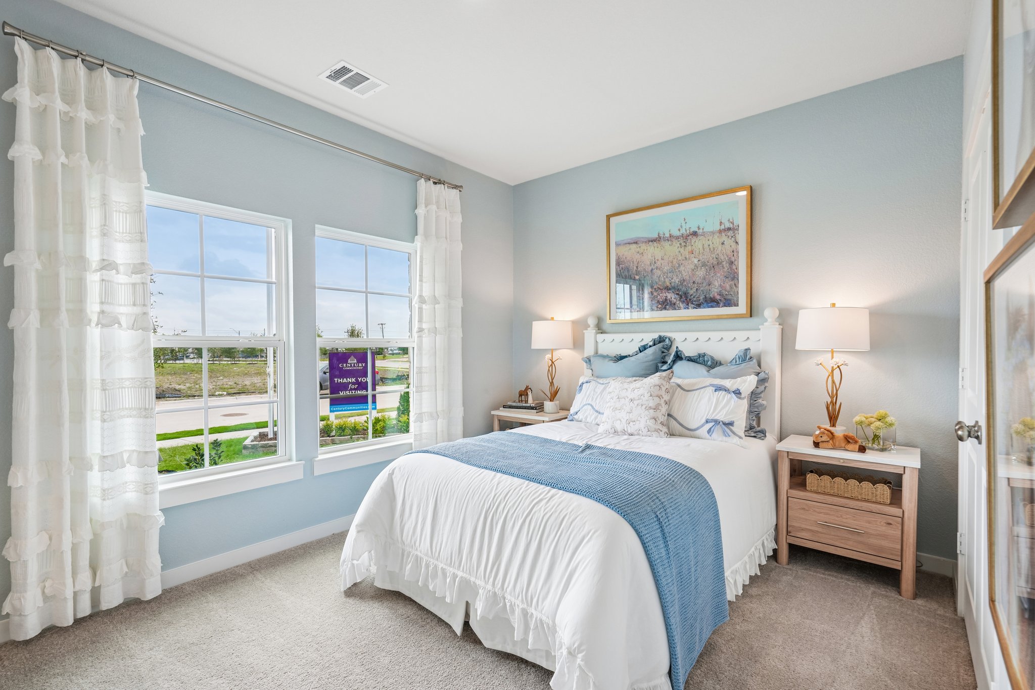 A bedroom with a bed and a window.