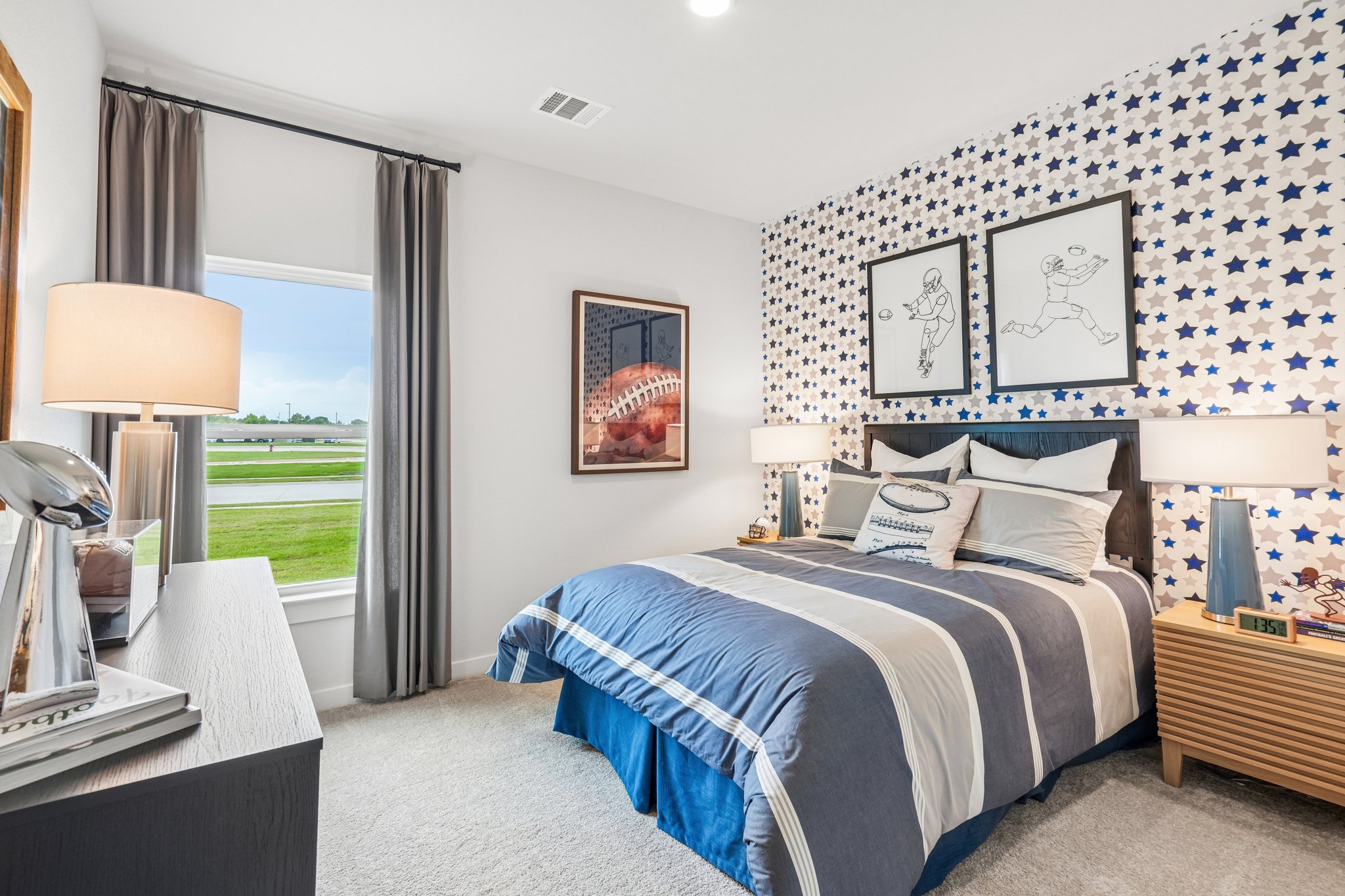 A bedroom with a bed and a window.