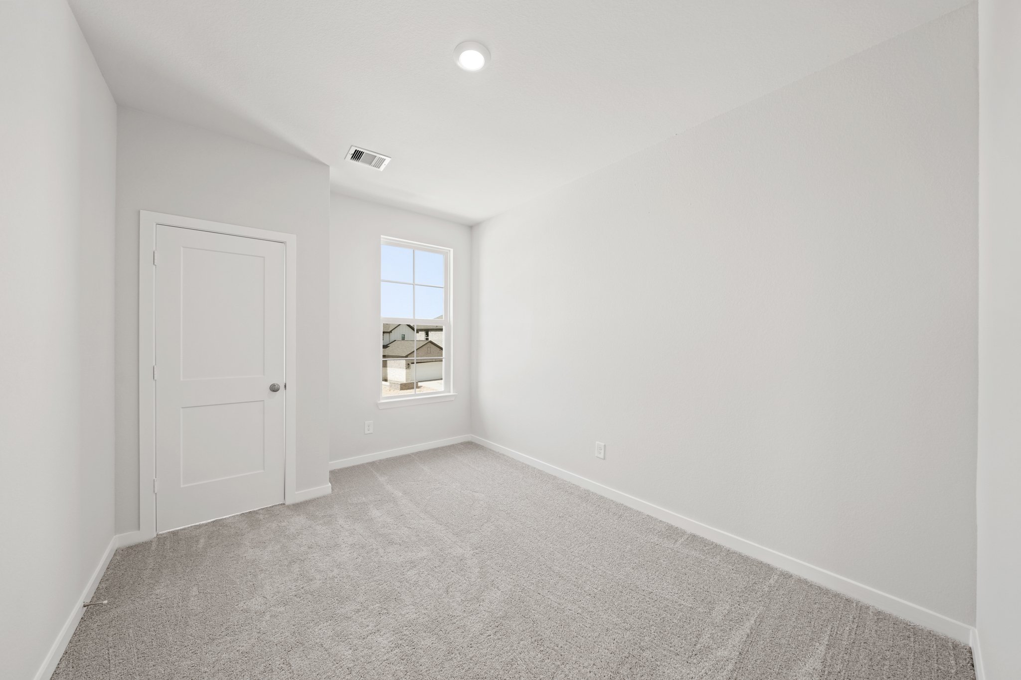 A room with a door and a window.