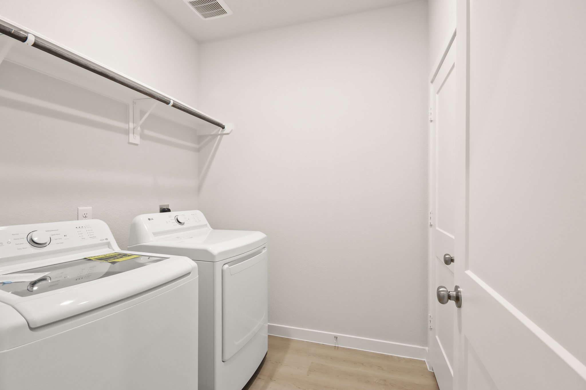 A washer and dryer in a room.
