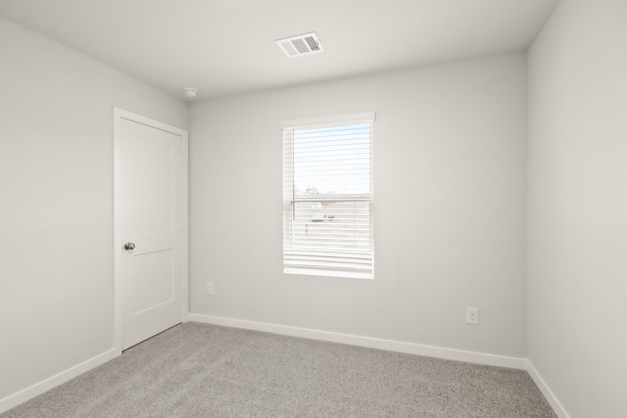 A room with a door and a window.